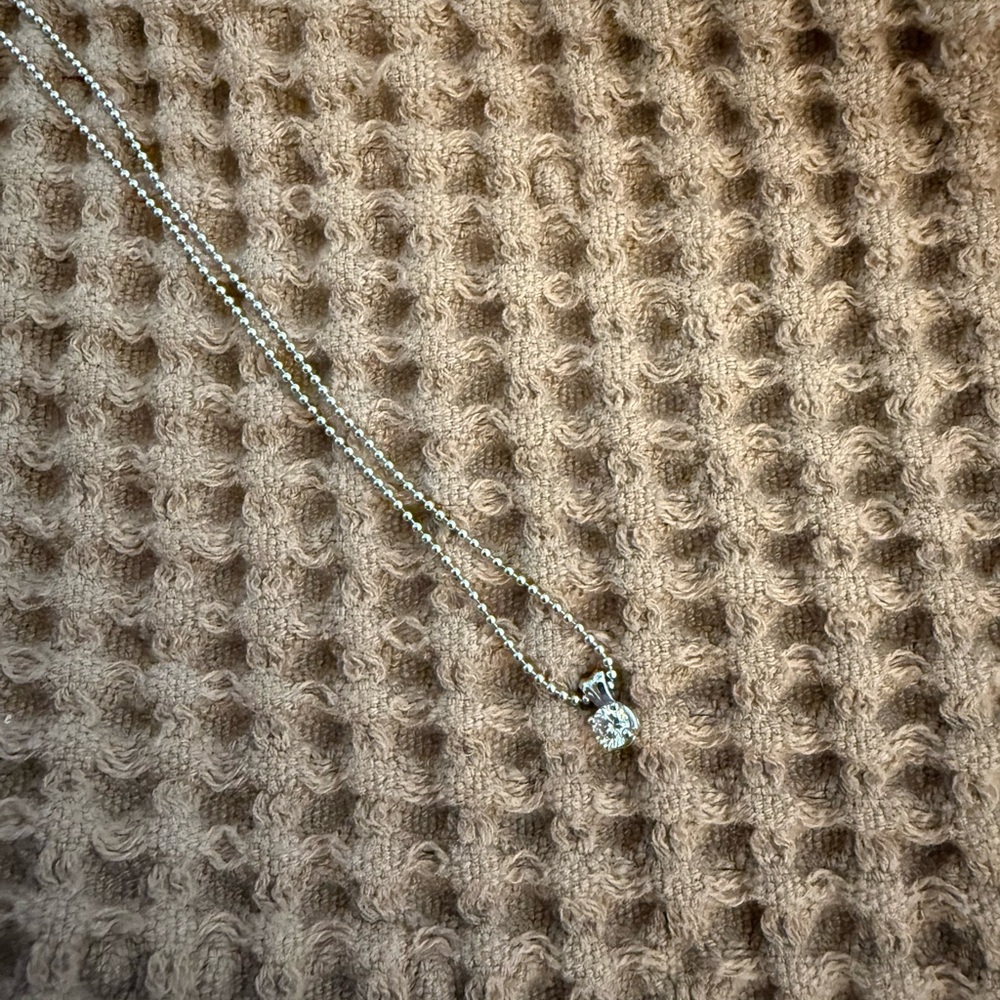 14K White Gold beaded necklace with Diamond solitare pendant.